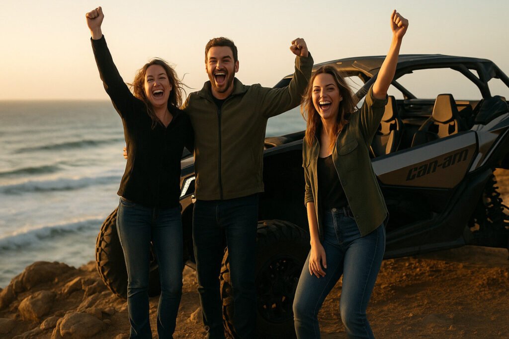 “Three happy customers beside a Can-Am Maverick X3 on a coastal cliff at sunset, cheering.”